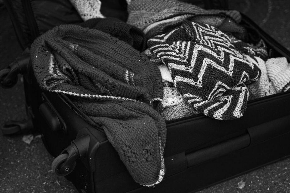 Illustration of Women's Wool Clothing After Travel: Exploring Care Guidance Before Trying to Refresh Packed Knitwear or Woven